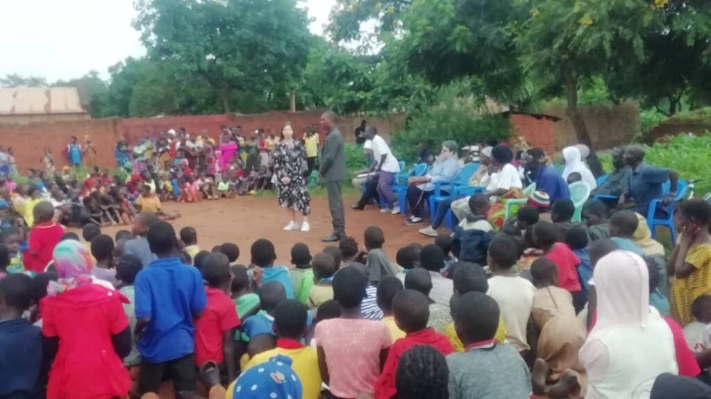 International Parents Alliance's Project Manager interacting with local participants during a community building event during the Malawi Study Visit