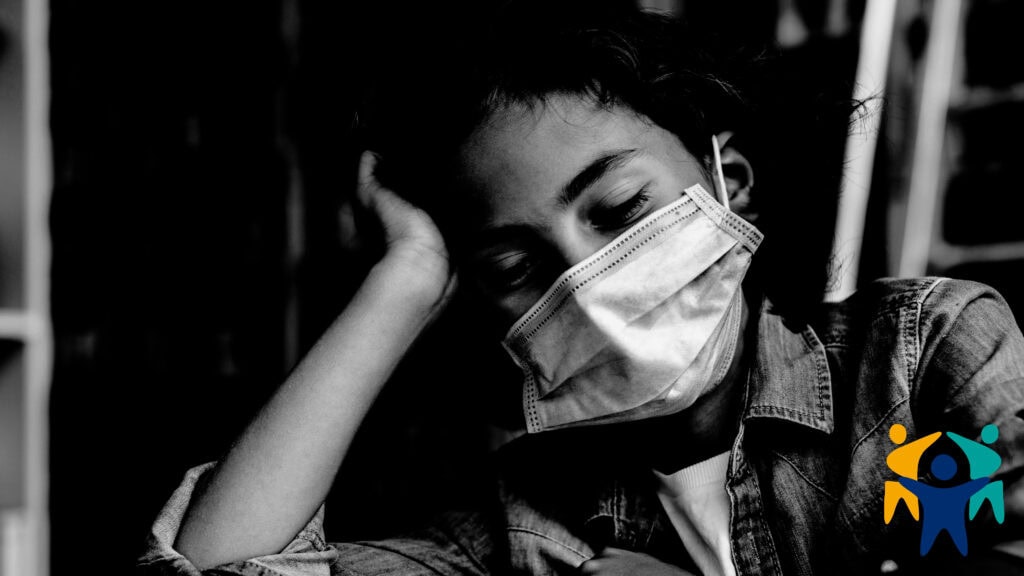 A disengaged student wearing a surgical mask. The adverse effects of Covid-19 policies on education beg the question, shared by the International Parents Alliance, of to save a generation