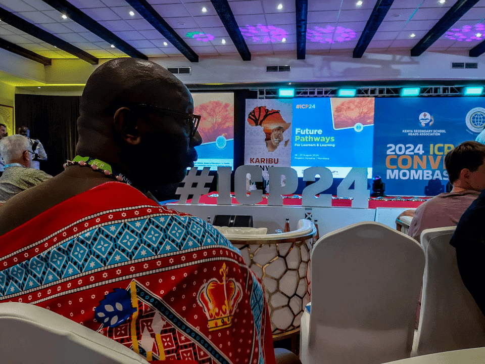 Kenyan participant in traditional garments embodying sharing, caring, and daring at the ICP World Convention in Mombasa, Kenya