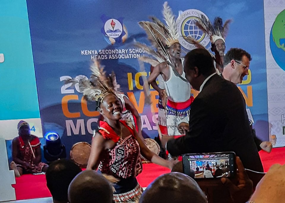 Close-up of a performance detail showcasing sharing, caring, and daring during the ICP World Convention in Mombasa, Kenya