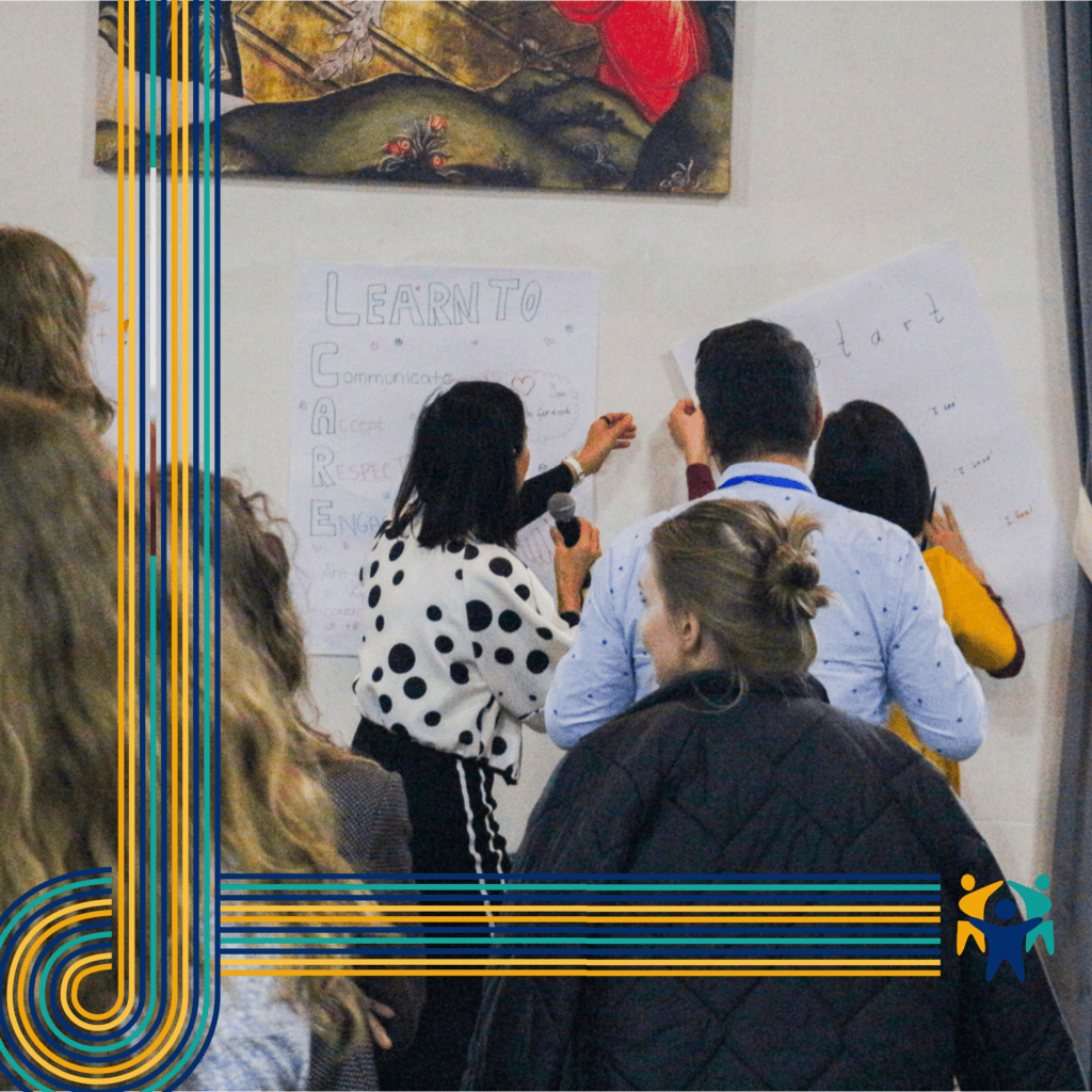 Participants engage in a discussion, guided by board display at the International Parents Alliance Summit